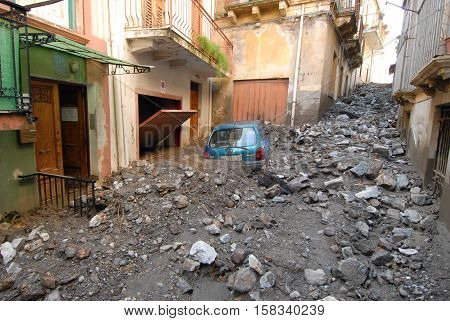Giampilieri, Italy - October 3 2009. A landslide has invaded the Sicilian town causing many deaths. The collapse of a mountain caused hundreds of tons of earth and rock fell on buildings and cars.