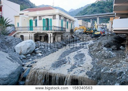 Scaletta Marina, Italy - October 3 2009. A landslide has invaded the Sicilian town causing many deaths. The collapse of a mountain caused hundreds of tons of earth and rock fell on buildings and cars.