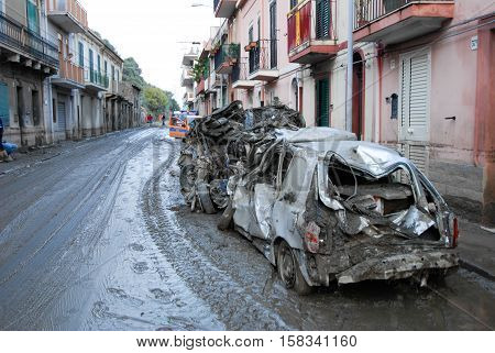 Scaletta Marina, Italy - October 3 2009. A landslide has invaded the Sicilian town causing many deaths. The collapse of a mountain caused hundreds of tons of earth and rock fell on buildings and cars.