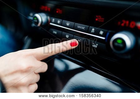 Woman Turns On Air Conditioning In The Car