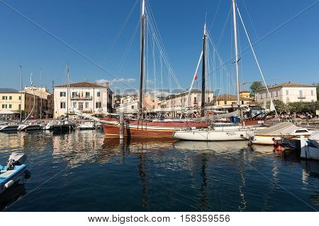 BARDOLINO, ITALY - MAY 4, 2016: Sailboats at Porto di Bardolino harbor on The Garda Lake . Italy