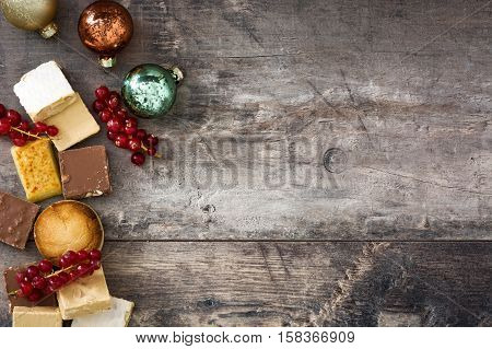 Christmas nougat and spanish polvorones on wooden background. Copyspace