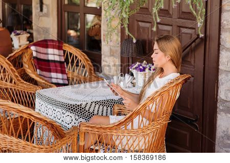 Young Woman In Caffee Looking Aside