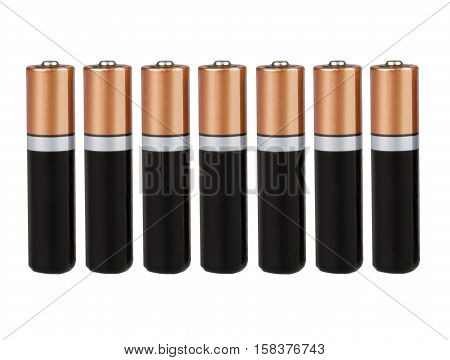 Seven batteries of the type AA in a single row on a white background, isolated