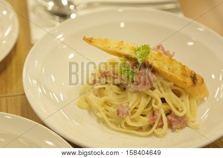 Spaghetti pasta with smoked beef ham and egg