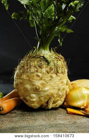 Ingredients for celeriac soup - celery root - celeriac carrots onion potatoes - healthy diet concept