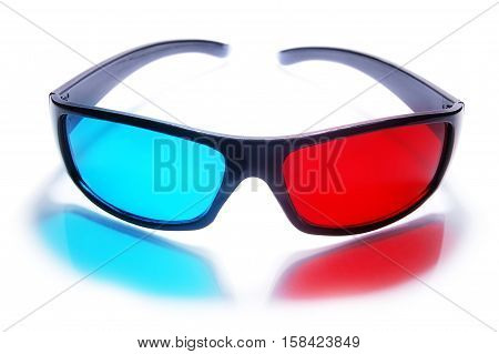 3d stereo anaglyph plastic glasses on a white background. 3d glasses create a red-blue reflection.