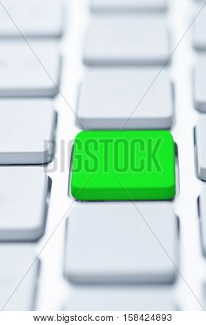 Macro shot of a green key with bokeh effect. Selective focus