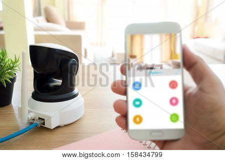 Security camera on Wood table. IP Camera