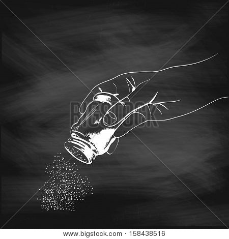 Illustration of a hand with the salt shaker painted chalk on a blackboard