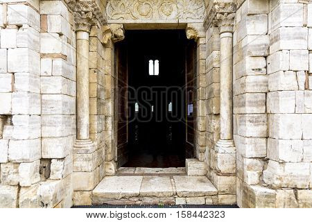 PIENZA,ITALY-APRIL 24,2016:Main entrance of the saint Antimo Abbey in Tuscany-Italy during a cloudy day.