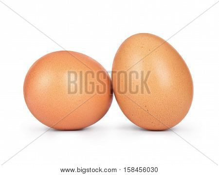 Two chicken eggs close-up isolated on white background