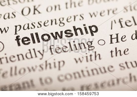 fellowship - word in dictionary. macro shot. selective focus