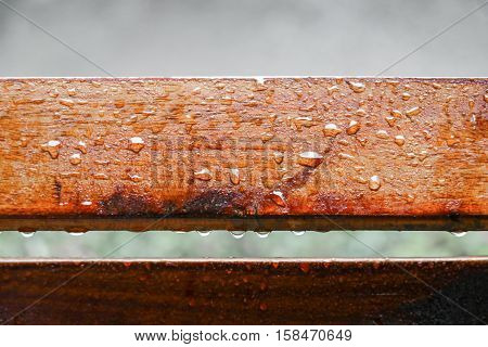 Drop of water on wood with raindrop after a rain with copy space.