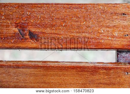 Drop of water on wood with raindrop after a rain with copy space.