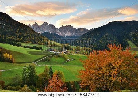 Funes Valley with fall color at sunrise Dolomites Italy