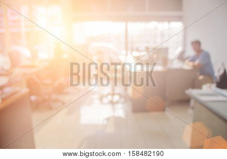 Businessmen blur in the workplace.Table Top And Blur Office of Background.abstract blur background table work in office with computer.Abstract background of office shallow depth of focus  silhouette.