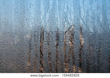 Water and rain drops on the glass. Rainy day