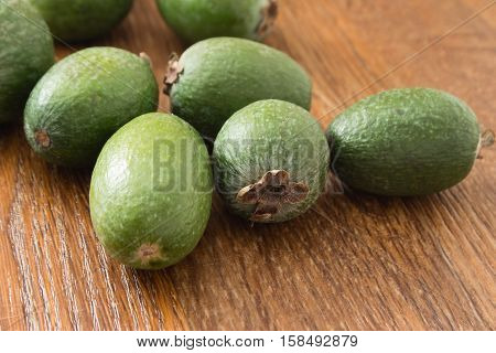 Feijoa fruit on wooden background, selective focus