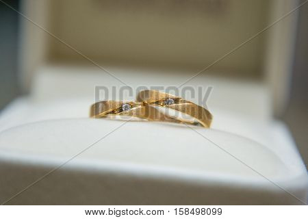 Two wedding rings on box. focus on jewelry
