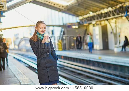 Beautiful Young Woman Waiting For A Train In Parisian Underground