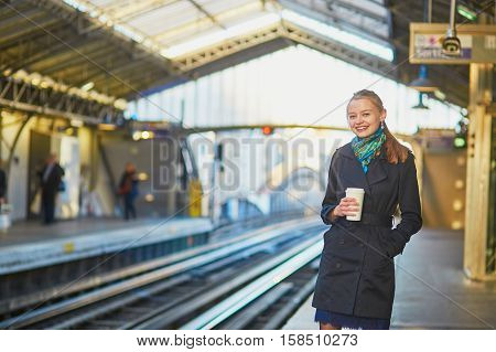 Beautiful Young Woman Waiting For A Train In Parisian Underground