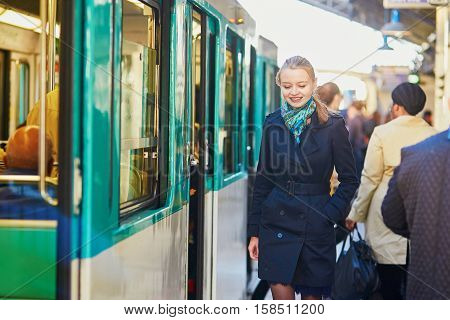 Woman Waiting For A Train On The Platform Of Parisian Underground
