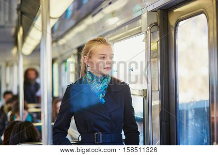 Woman Travelling In A Train Of Parisian Underground