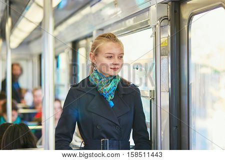 Woman Travelling In A Train Of Parisian Underground