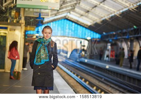Young Woman Waiting For A Train On The Platform Of Parisian Underground