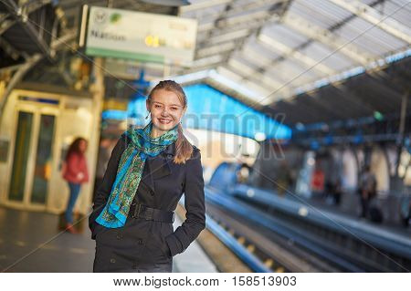 Young Woman Waiting For A Train On The Platform Of Parisian Underground
