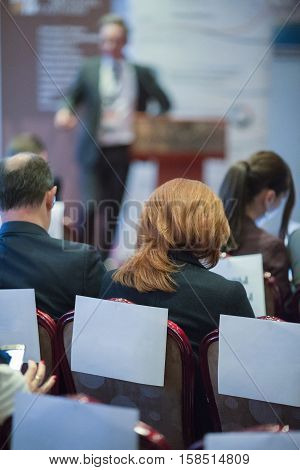 Male Host Speakers Standing in Front of the Audience During the Conference. Vertical Imsge