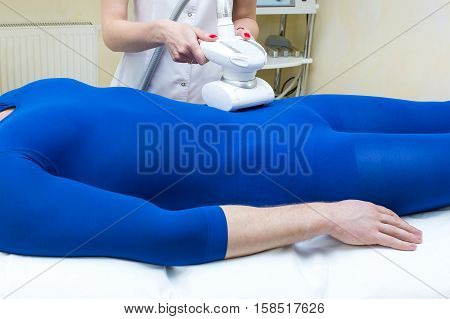 Male is in the process at the clinic lipomassage