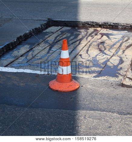 Repairing the asphalt pavement on the road.