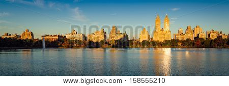 Fall in Central Park at the Jacqueline Kennedy Onassis Reservoir. Panoramic Autumn morning view on the Upper West Side, Manhattan, New York City
