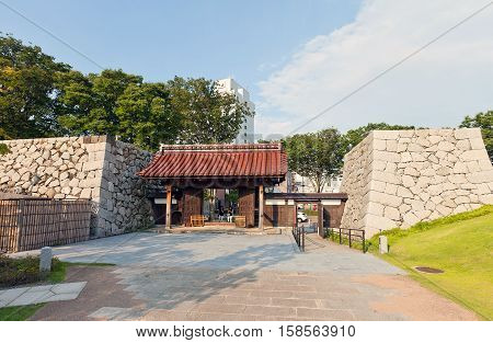 TOYAMA JAPAN - JULY 31 2016: Reconstructed yakuimon type gates and stone walls of Toyama castle. Castle was founded in 1543 by Jinbo Nagamoto dismantled in 1870 reconstructed in 1954