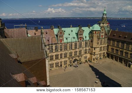View from roof to renaissance castle Kronborg courtyard to Helsingborg city and strait between Denmark and Sweden.
