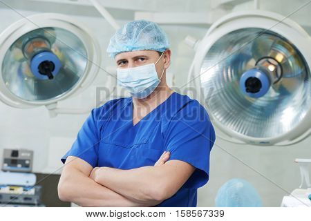 male cardiac surgeon at cardiosurgery operating room