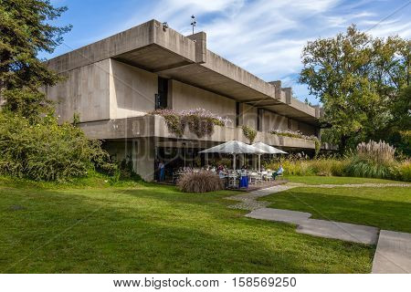 Lisbon, Portugal - October 19, 2016: Cafeteria of the Calouste Gulbenkian foundation seen from the garden. Popular park amongst college students.