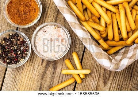 Crispy bread sticks with salt and spices. Studio Photo