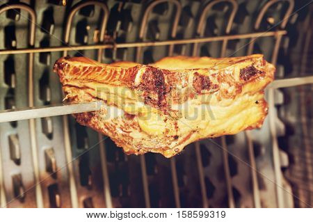 Pork ribs cut on electric grill, toned image