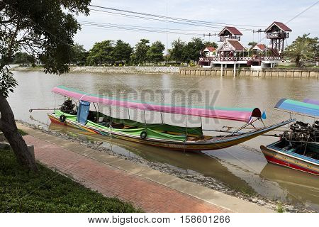 AYUTTHAYA, THAILAND - November 4, 2016: View of a long tail boat a type of watercraft native to Southeast Asia which uses a common automotive engine in the Chao Phraya River Thailand