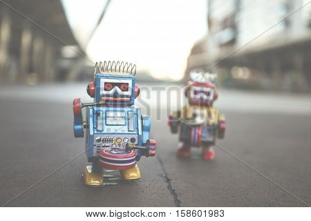 Old robot toy, vintage color style, vintage tone background.