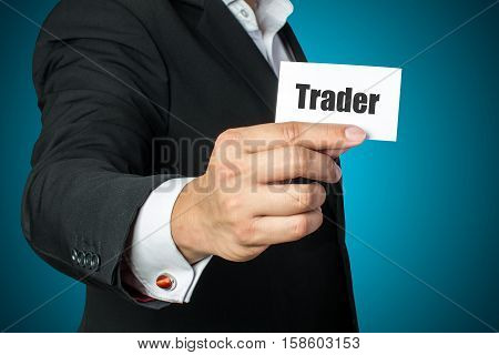 Businessman with trader card on chest in black suit