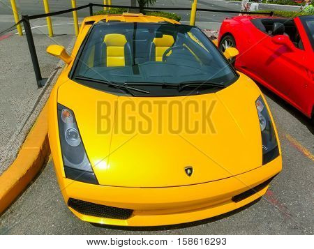 Las Vegas, United States of America - May 05, 2016: Luxurious and Colorful Cars for Rent Waiting in the Parking Lot of a Supermarket on the Las Vagas Strip, Nevada on May 05, 2016