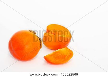Ripe persimmon kaki fruits isolated on white background. Diospyros kaki.