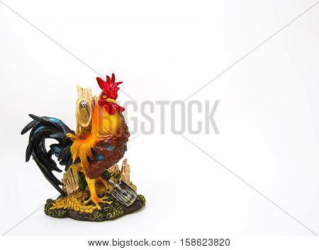 The statue stands as a majestic colorful chicken2017 Happy new year for sign and symbols. toy isolated rooster for 2017