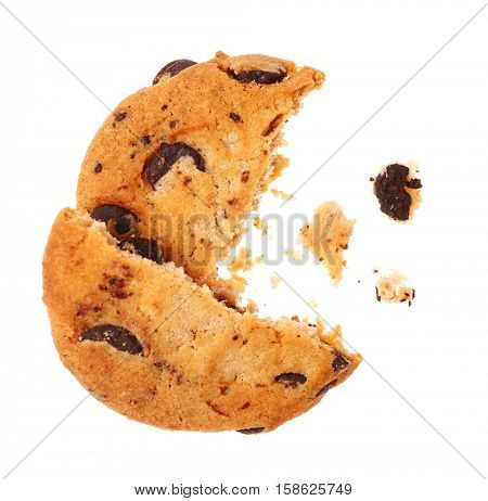 Tasty cookie with chocolate chips and crumbs on white background