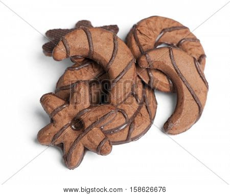 Heap of chocolate cookies in different shape isolated on white background