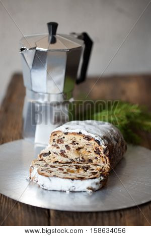 Christmas stollen. Traditional German, European festive dessert. Ingredients cranberries, pine nuts for Christmas Stollen. Stollen cake cut into pieces. Christmas food card.